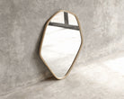 ELE124 Mirror - Modern geometric wall mirror against a concrete wall.