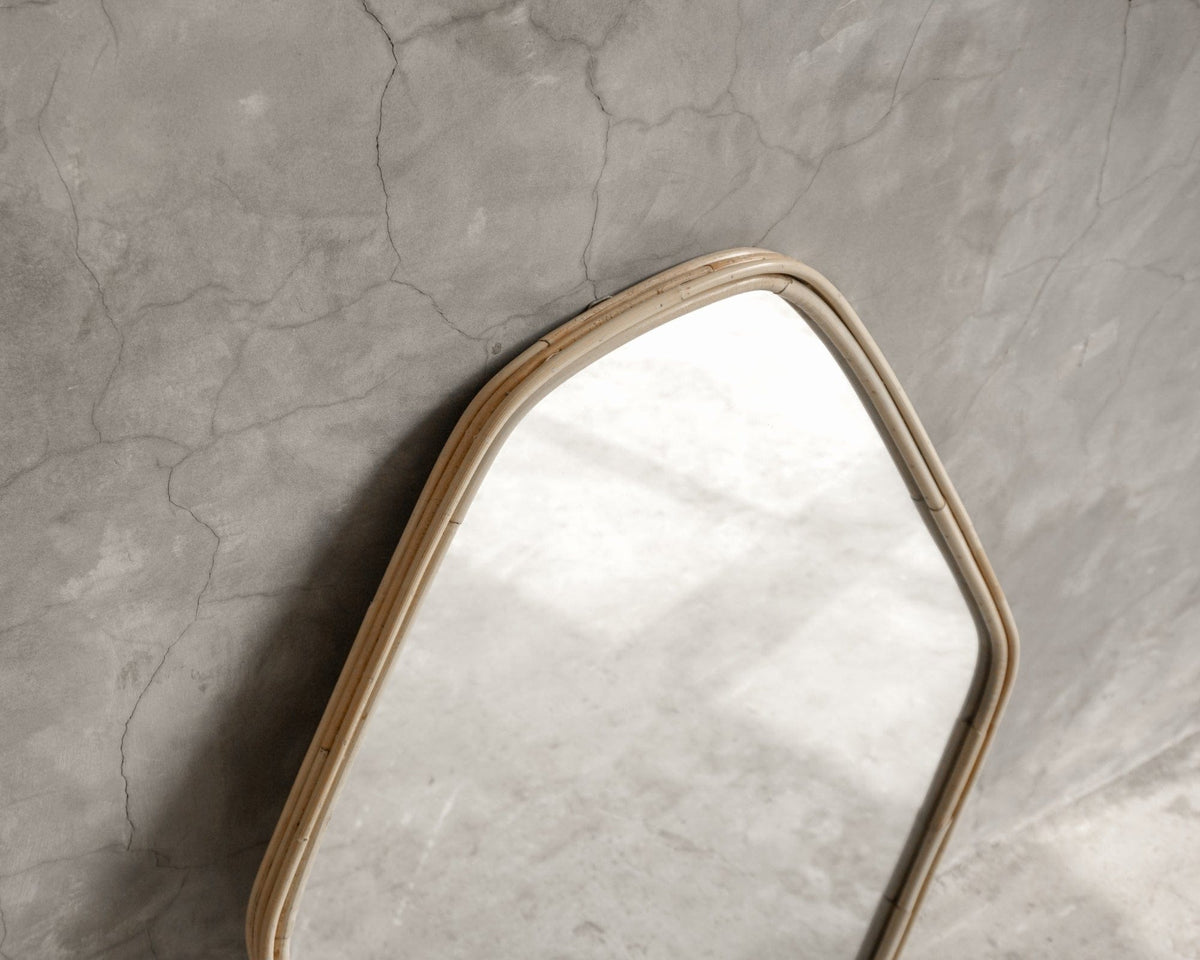ELE126 Mirror with rattan frame on concrete wall