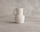 ELE137 white handled vase on gray background