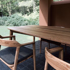 Outdoor wooden table and chairs on patio