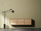 Modern floating wooden cabinet with floor lamp