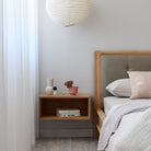 Bedroom decor with wooden bedside table and decor