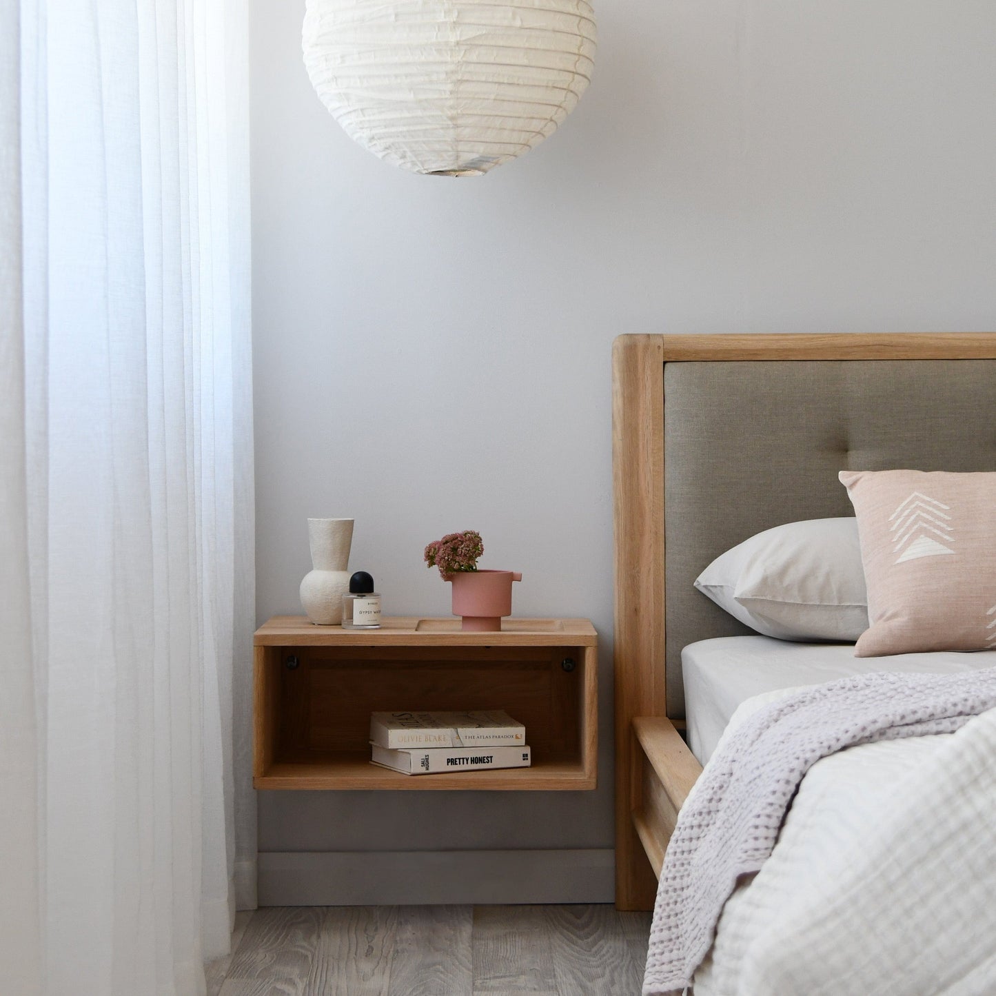 Bedroom decor with wooden bedside table and decor