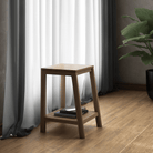 KCC24O wooden side table with books, near window and plant