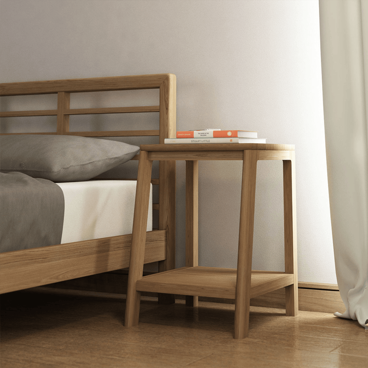 Wooden nightstand with books next to bed