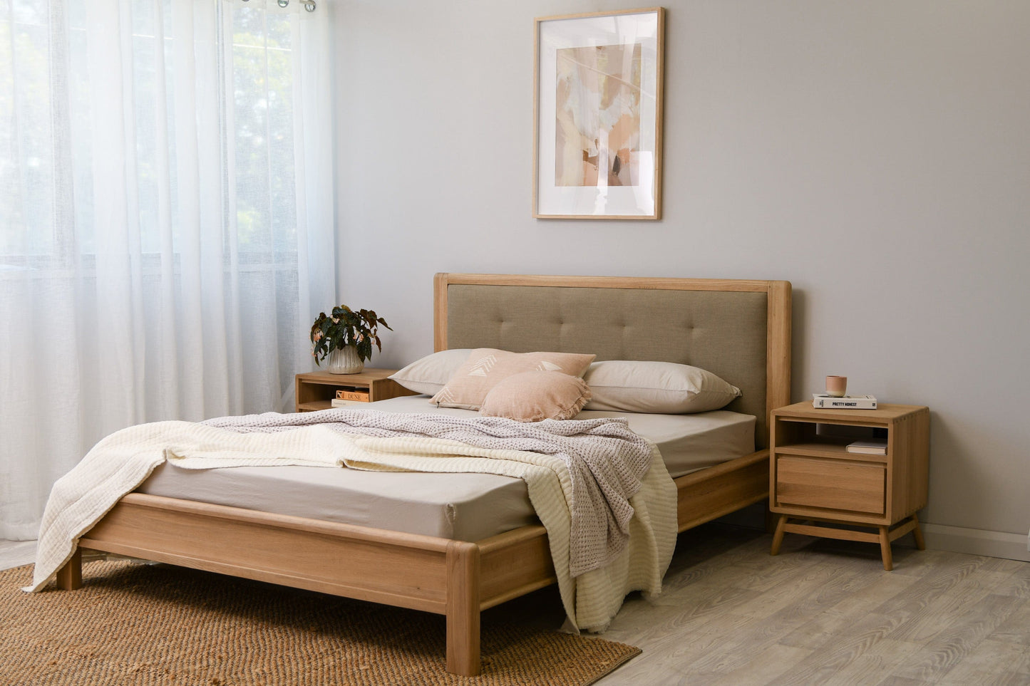 Wooden bed frame with upholstered headboard in bedroom.
