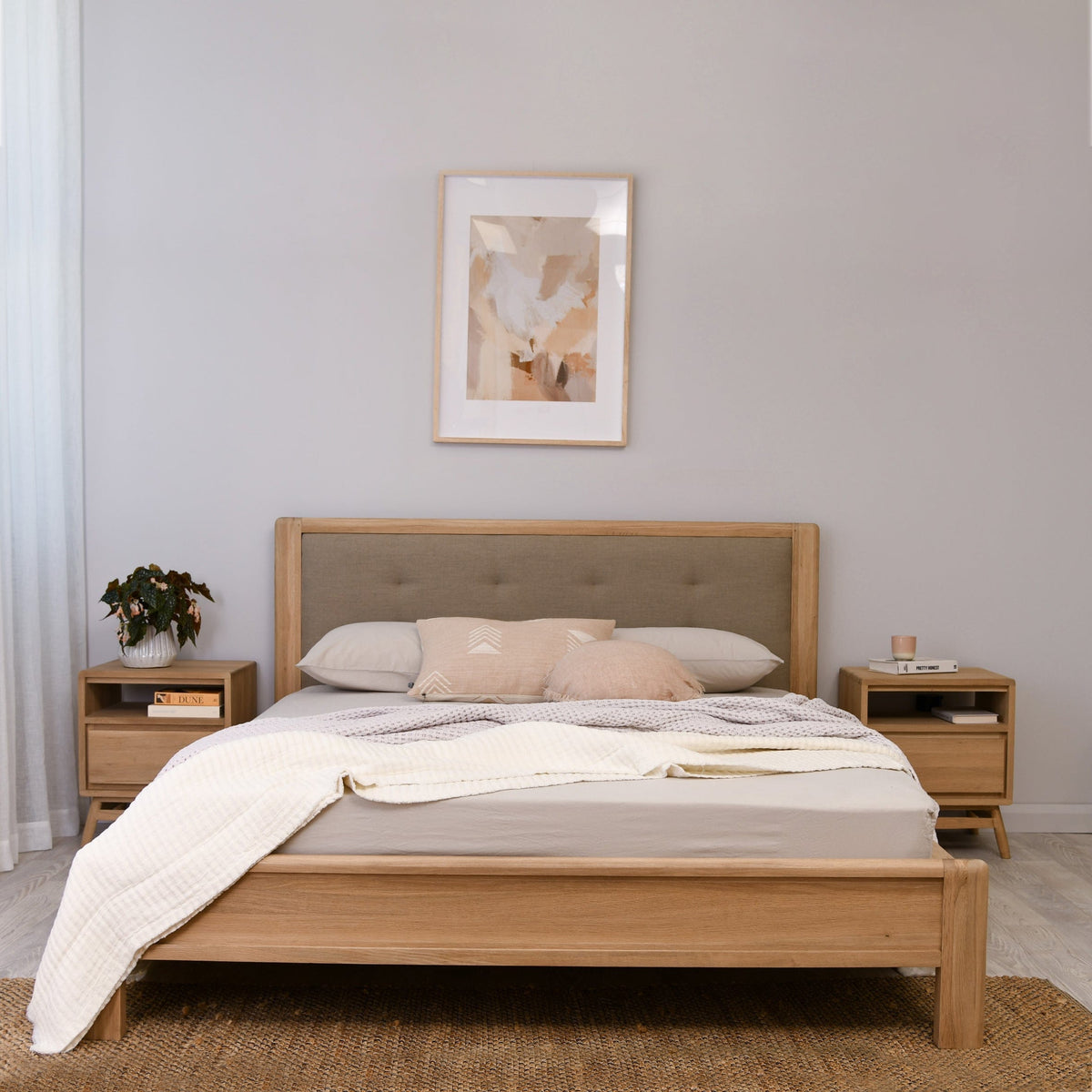 Wooden bed frame with upholstered headboard and nightstands
