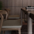 Wooden chairs and table in a minimalist interior.