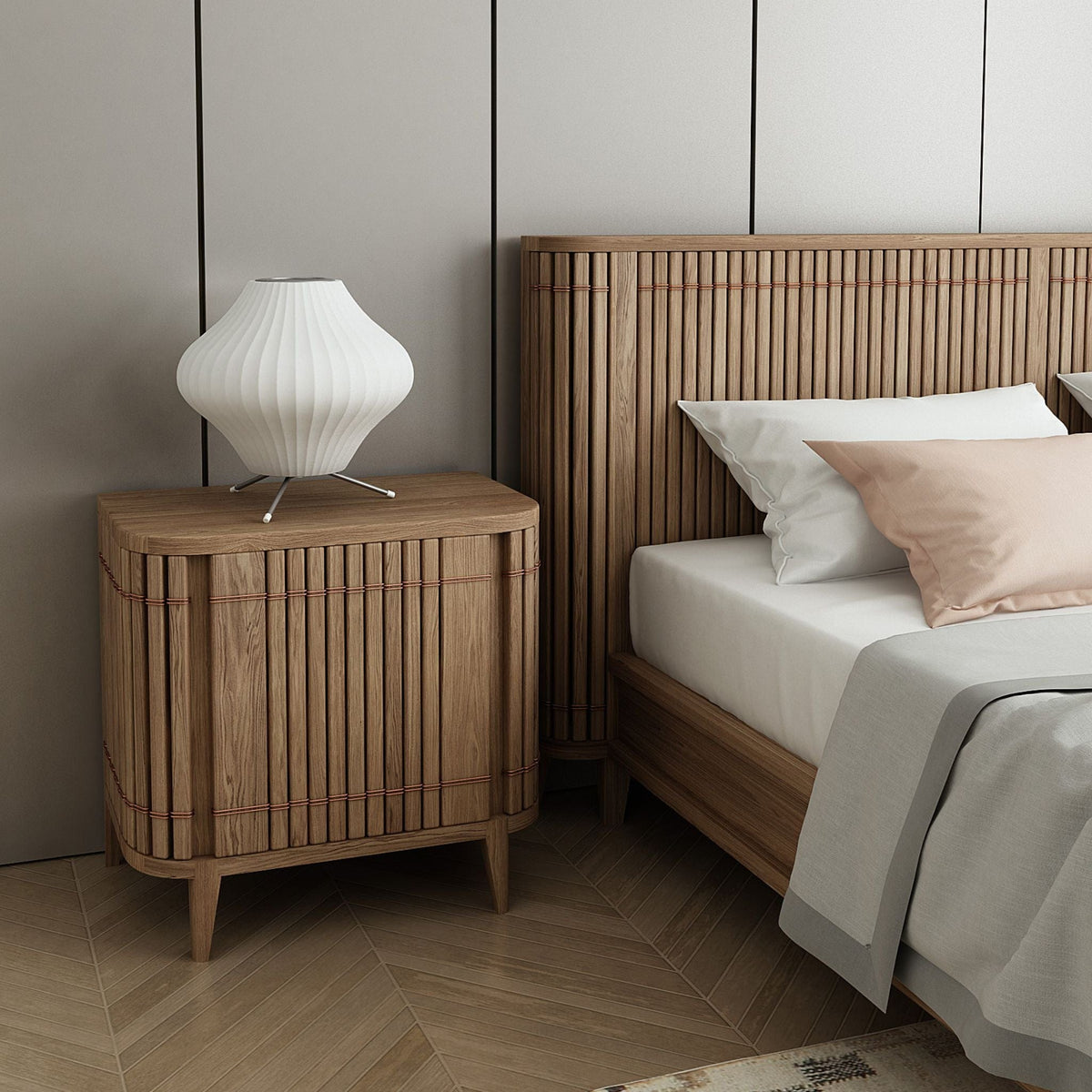 Wooden nightstand with lamp and bed