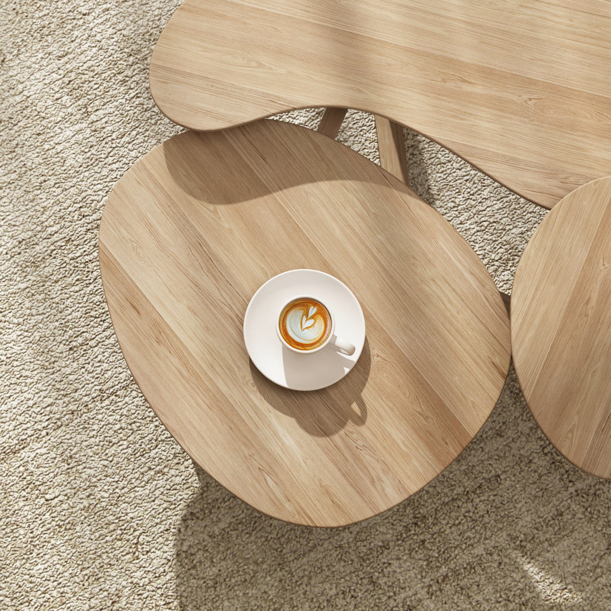 Coffee table with cappuccino on rug