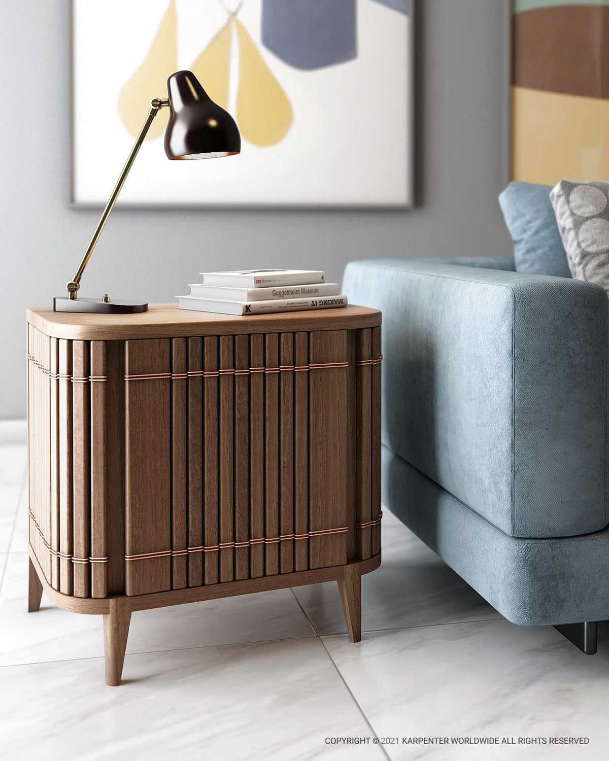 KOPPARSidetable with lamp and books next to blue sofa