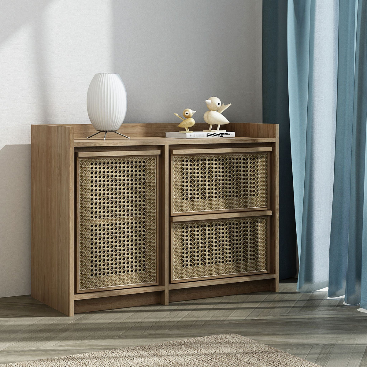 Wooden cabinet with rattan doors and drawers, lamp and decor.