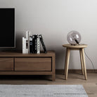 Modern lamp & books on wooden side table