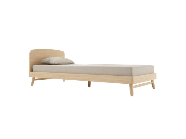 Light wood bed frame with mattress and pillow