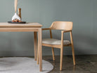 Wooden dining chair with table, neutral tones