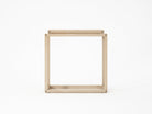 Square wooden side table on white background