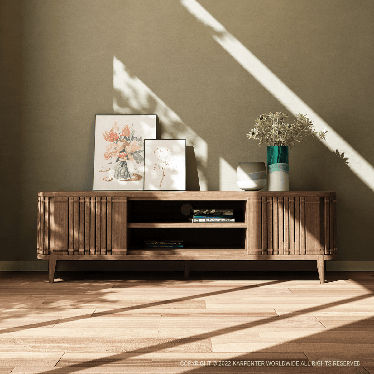 Koppar Media Cabinet with artwork and vase on a wooden cabinet.