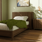 Koppar Single Bed in a cozy bedroom setting
