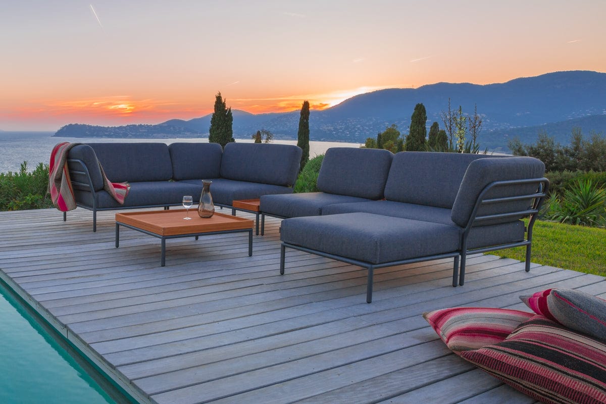 Dark grey HOUE LEVEL outdoor sectional set by the pool.