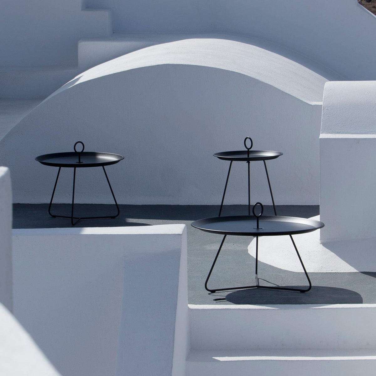 Outdoor side tables on white steps