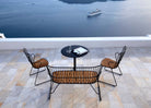 Patio furniture with ocean view and cruise ship