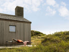 Molo Charcoal House with lounge chair and ocean view