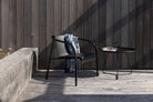 Black EYELET lounge chair and Houe table on deck