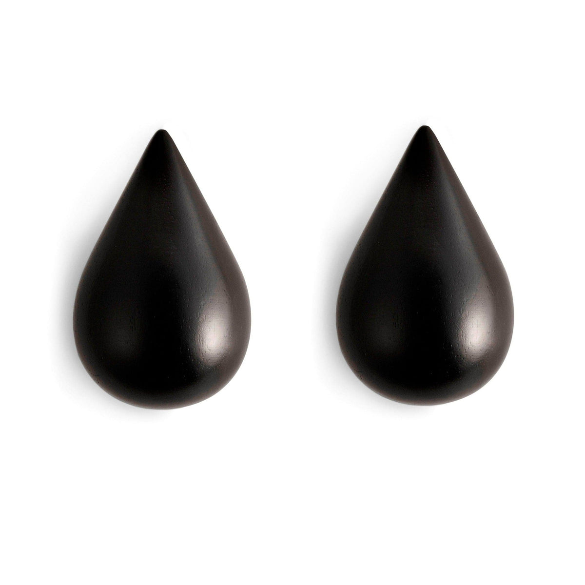 Two black teardrop-shaped objects