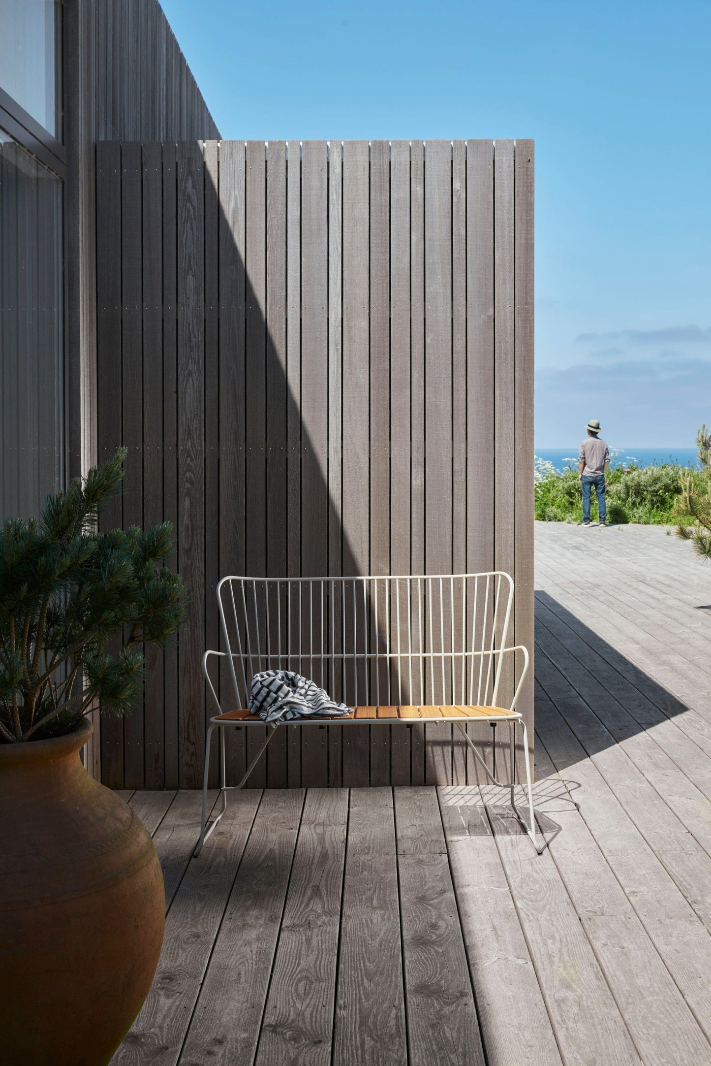 PAON Bench on wooden deck with ocean view