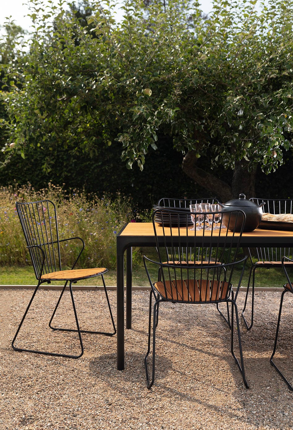 PAON black dining table with four bamboo chairs