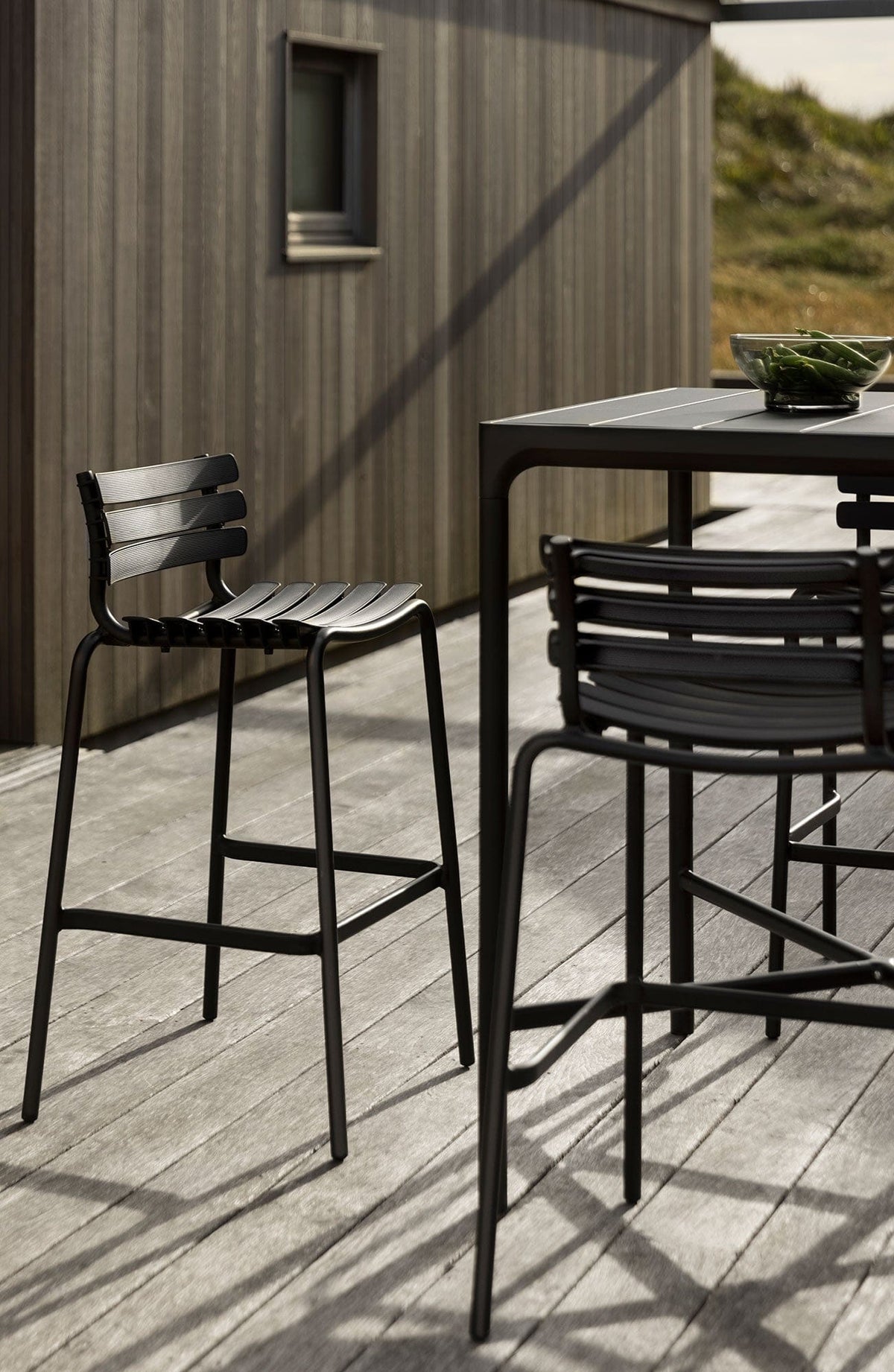 ReCLIPS black bar stools on deck