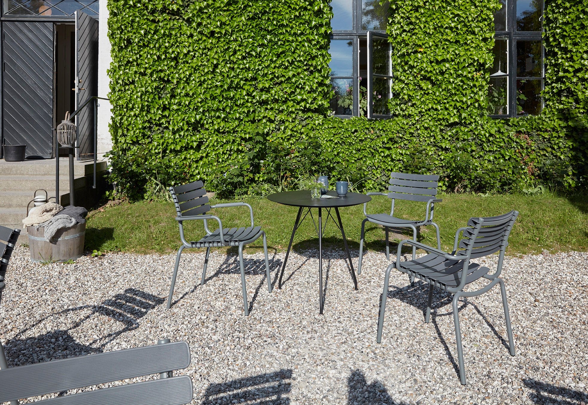Dark grey ReCLIPS dining set with black table on patio