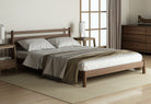 TakuBed Type 2 Queen Size Bed with Circa Side Table in a modern bedroom