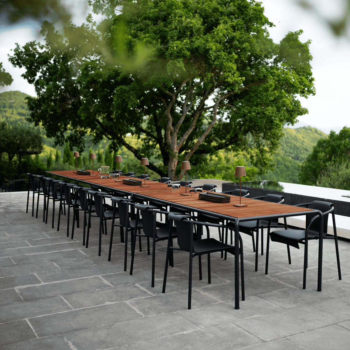 Long outdoor dining table with chairs