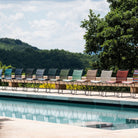 Colorful armless outdoor chairs by pool