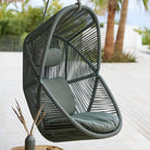 Grey hanging Hive chair outdoors