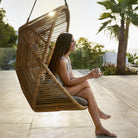 Woman enjoying Hive Lounge Chair