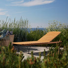 Molo wooden chaise lounge by the sea