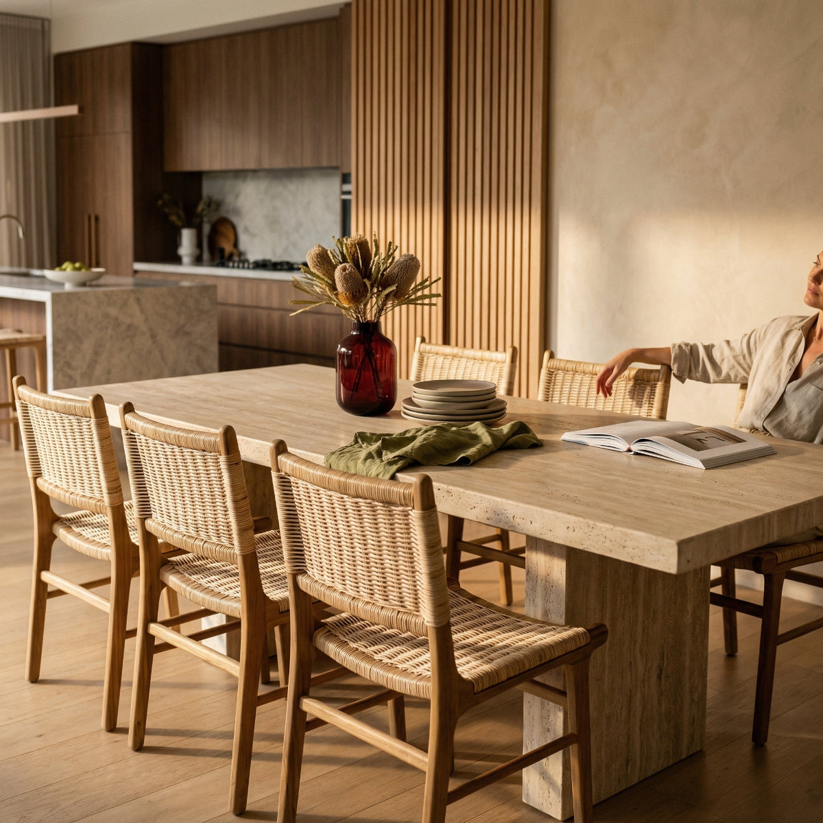 Dining area with wooden table and chairs in a modern kitchen.