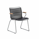 Black dining chair with wood armrests