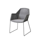 Grey wicker outdoor chair with metal legs