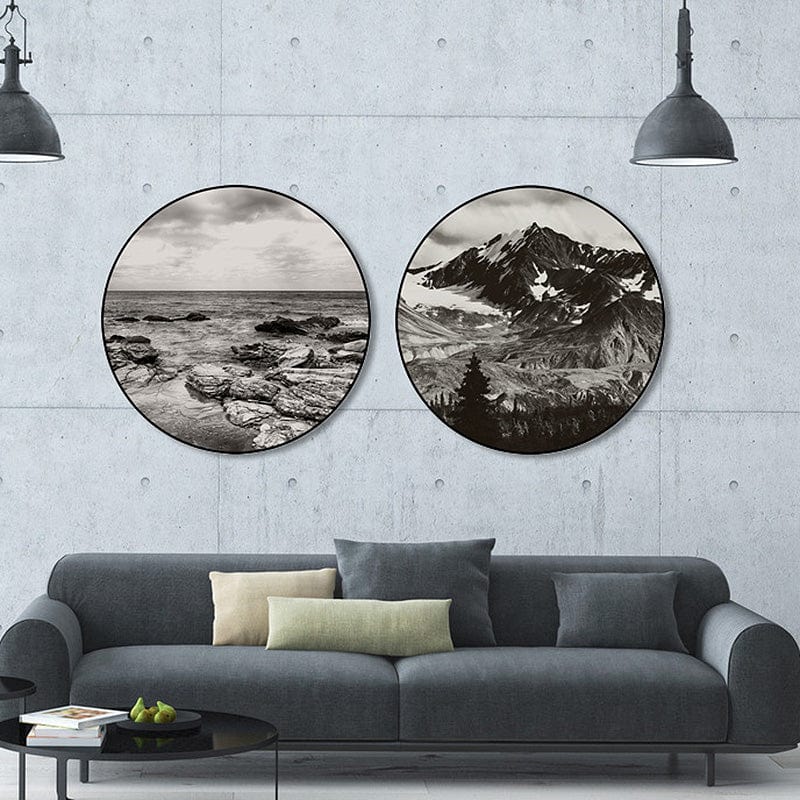 Black and white mountain and sea art on concrete wall.