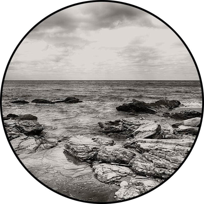 Black and white coastal rocks and sea