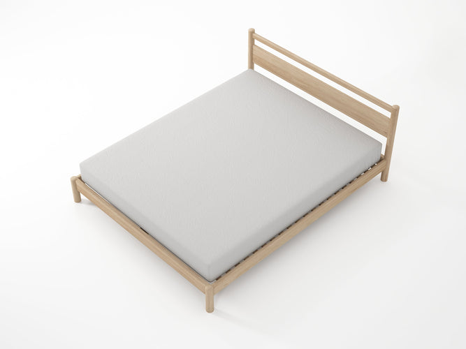 Wooden bed frame with a gray mattress