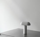 Modern grey table lamp on a surface