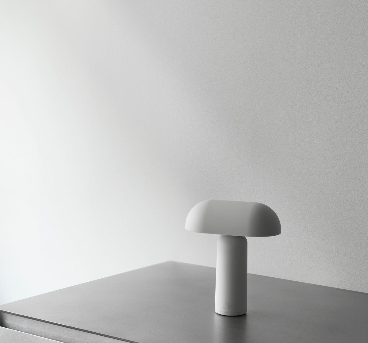 Modern grey table lamp on a surface
