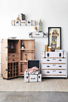 Trunk-style furniture set with shelves and bar cabinet.